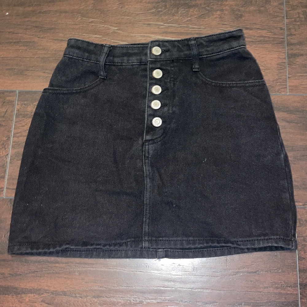 Black denim skirt, size small, 5 buttons in front.